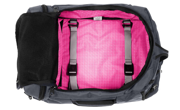 An open Techonaut 30 with a Nebulous Grey (dark grey) exterior and an Cerise (bright pink) interior.